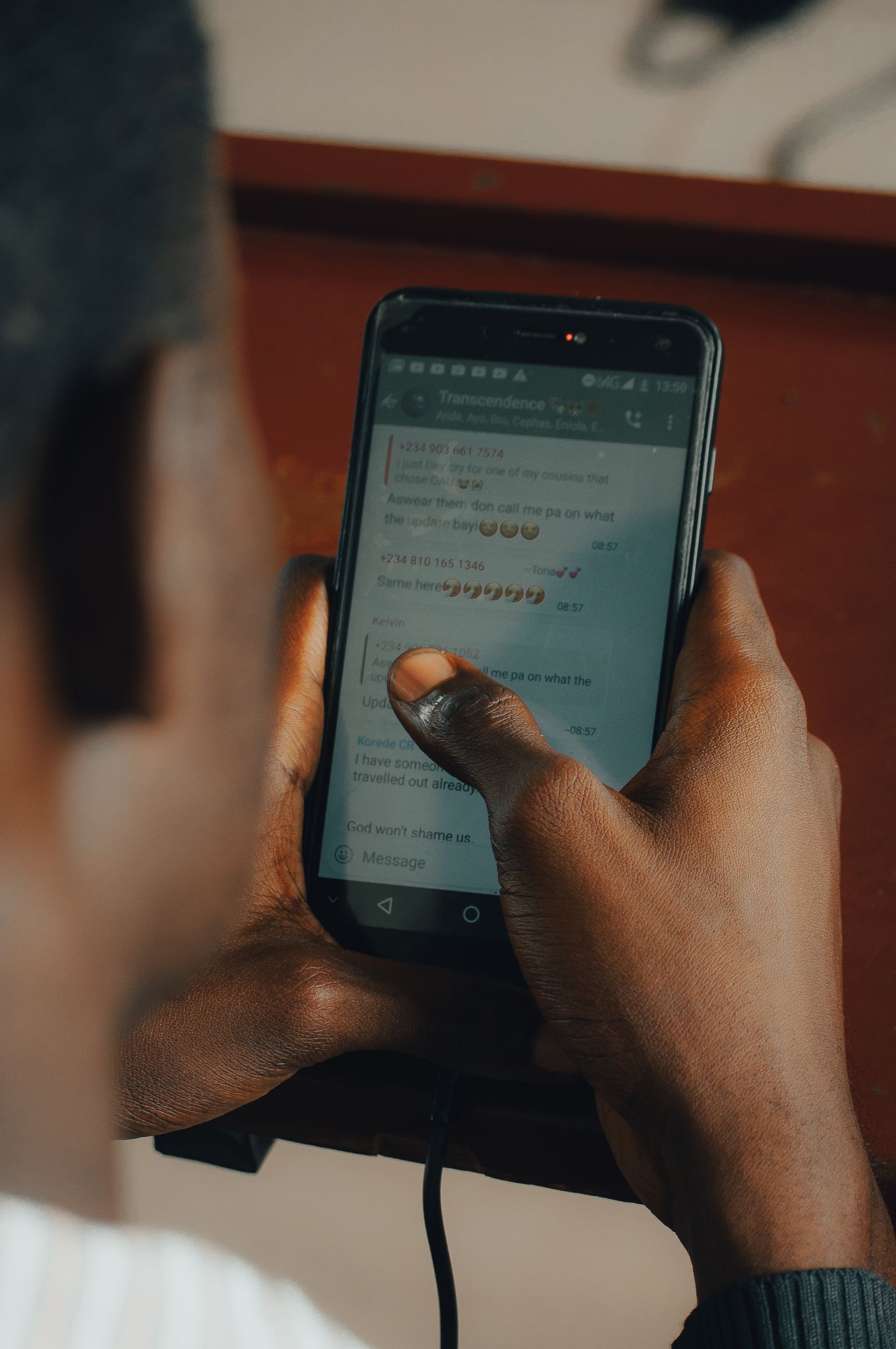 A person using a smartphone to join a conversation