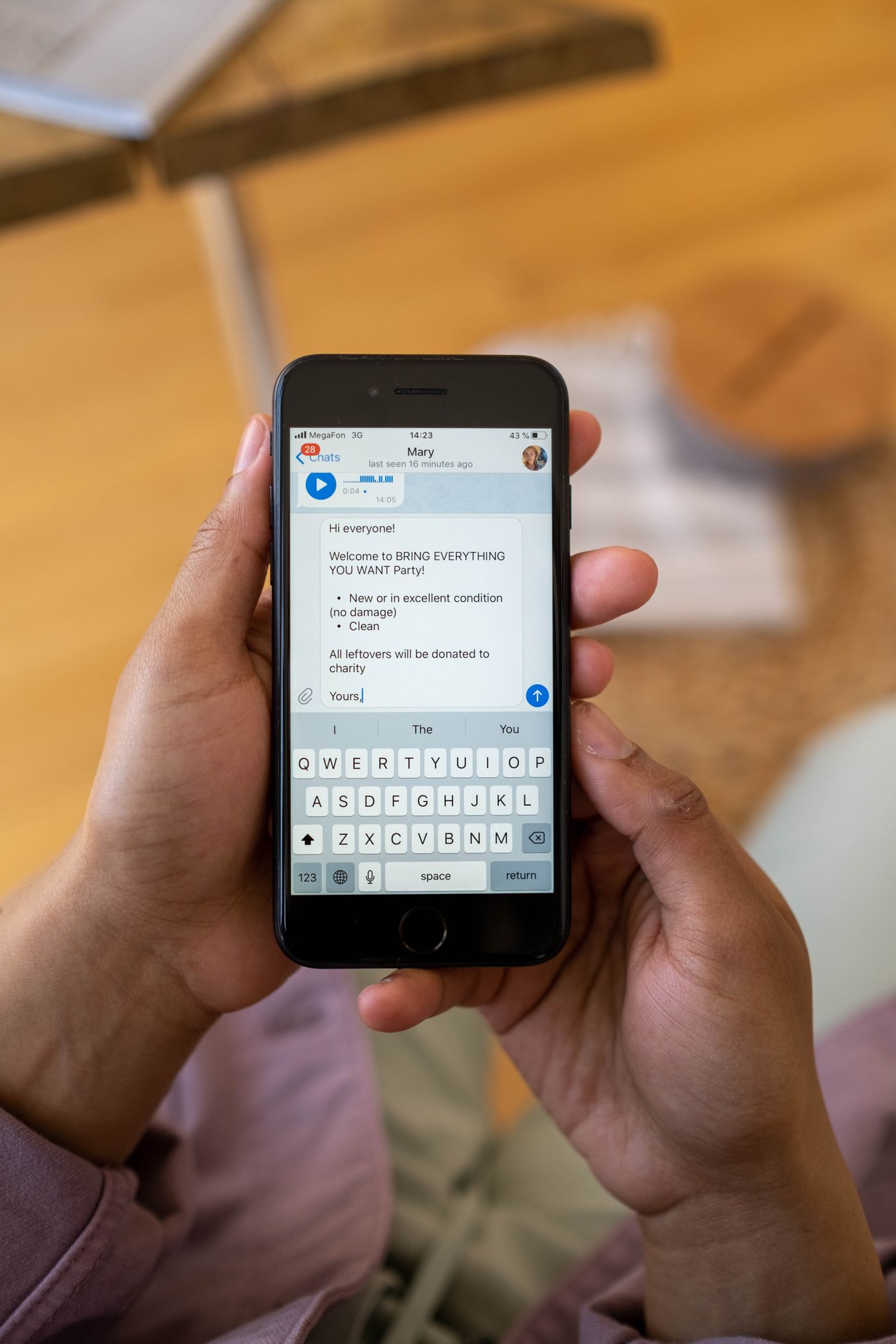 A person typing a message on a smartphone